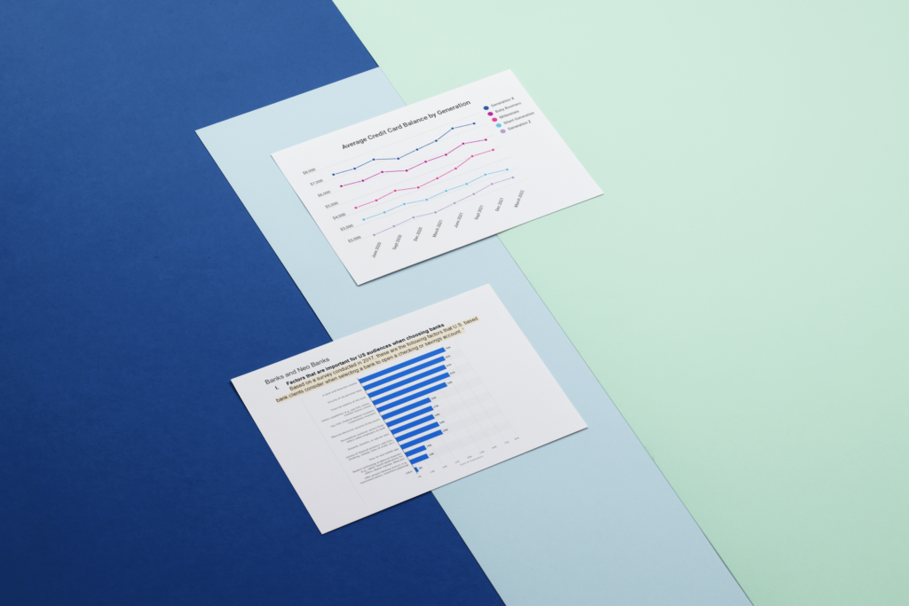 Two printed charts placed on a blue and mint green background